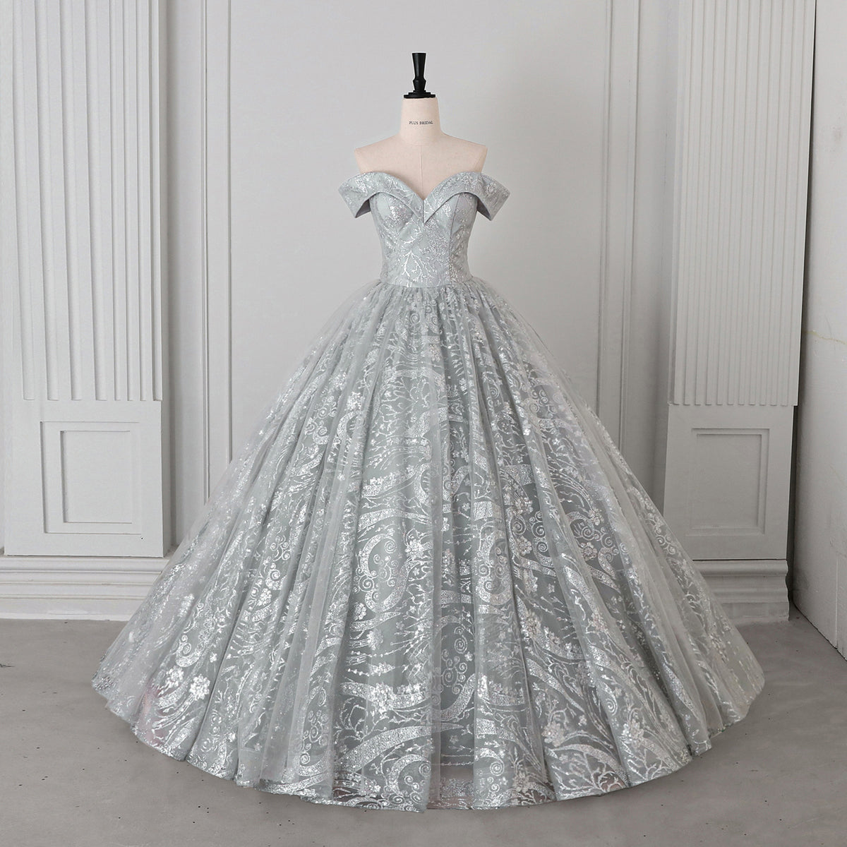 Silver Glitter Tulle Sequined Paisley Off-Shoulder Ball Gown - Front View Mannequin