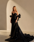 Strapless Deep V-Neckline Allover Beaded Sequin Boned Corset Bodice Bodycon Mermaid Sweep Train with Detachable Ruffled Rosette Organza Cape - Front View with Cape in Black