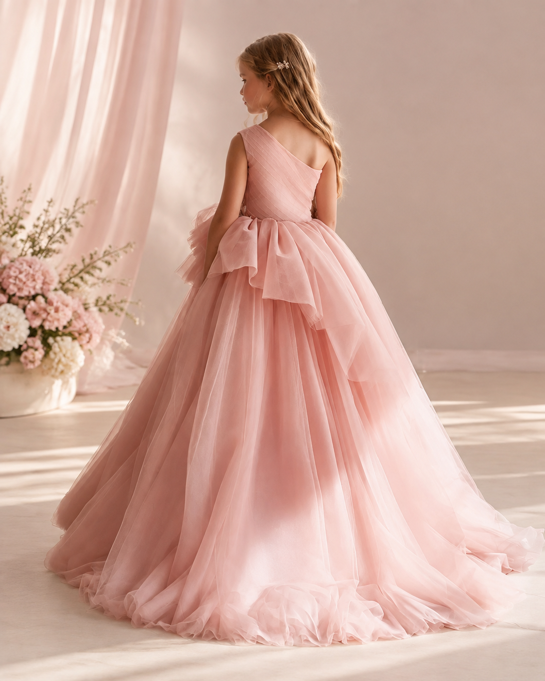Tulle one-shoulder cascading ruffle floor-length flower girl dress - back view in blush pink
