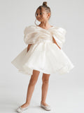 Satin off-shoulder puff sleeve ruched bodice lace-up back bubble hem mini flower girl dress - front view in ivory