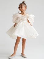 Satin off-shoulder puff sleeve ruched bodice lace-up back bubble hem mini flower girl dress - front view in ivory